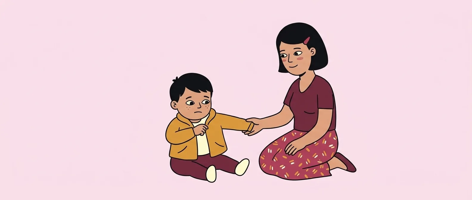 Parent supporting a toddler through a difficult moment